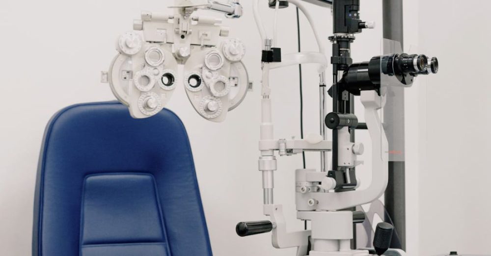 Lab Automation - Interior of modern medical office equipped with chair and phoropter for treatment and checking eyesight