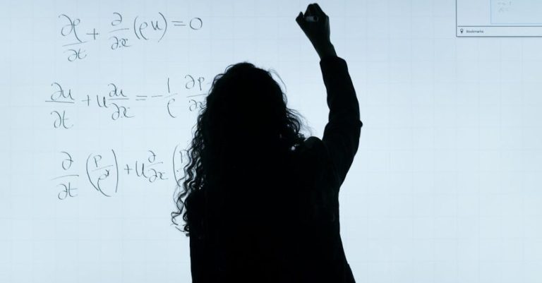 Scientific Research - Woman Writing On A Whiteboard