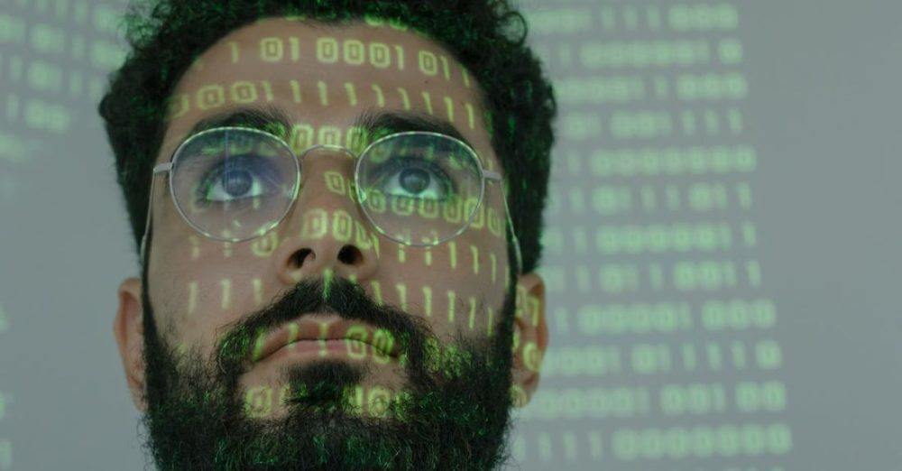 Scientific Technology - Man With Binary Code Projected on His Face